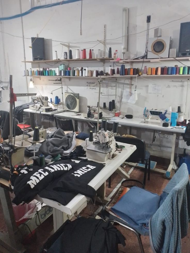 Inside the Trashy Steez workshop - sewing machines and rows of coloured thread spools