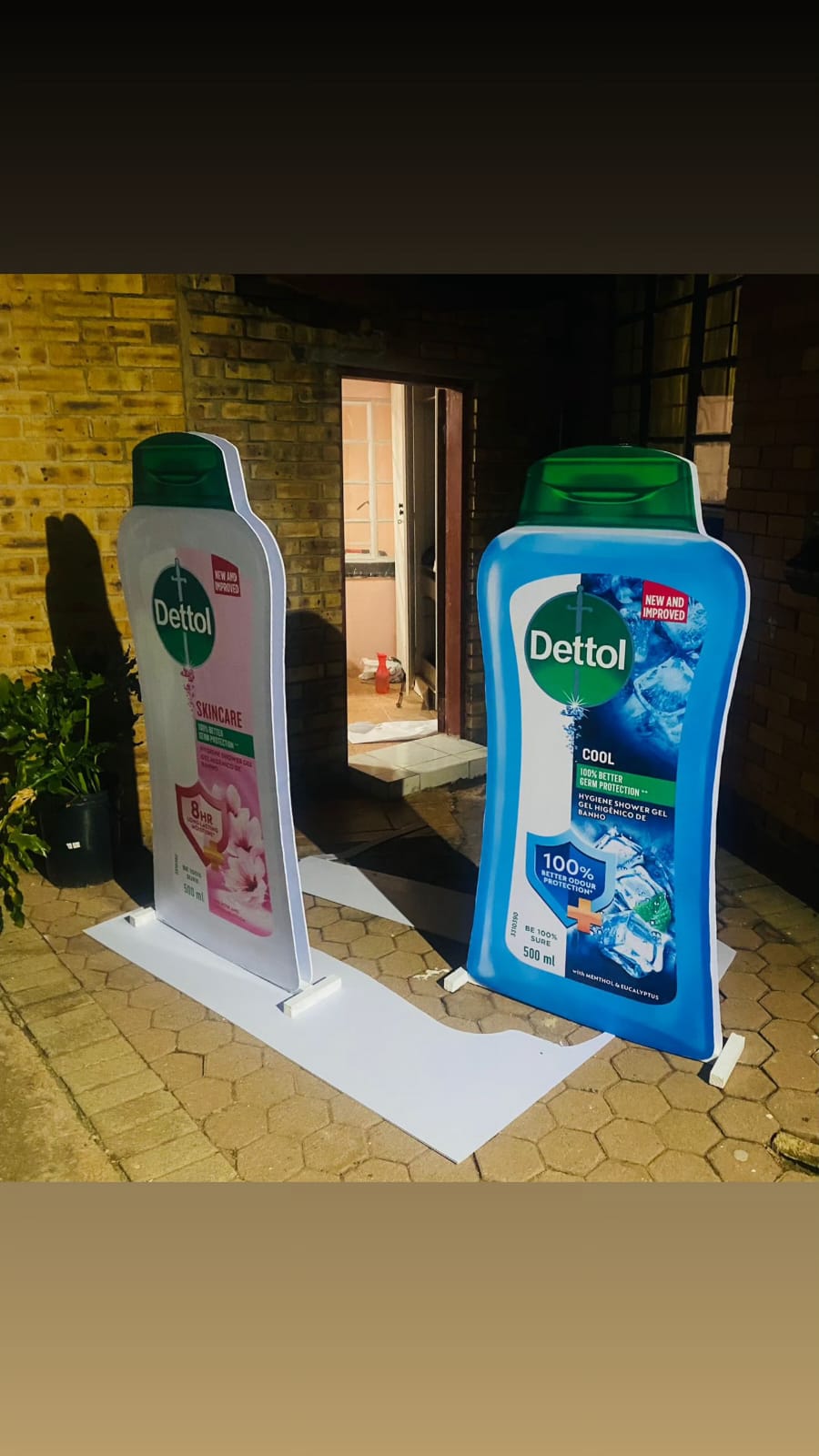 Two giant Dettol bottle-shaped display stands