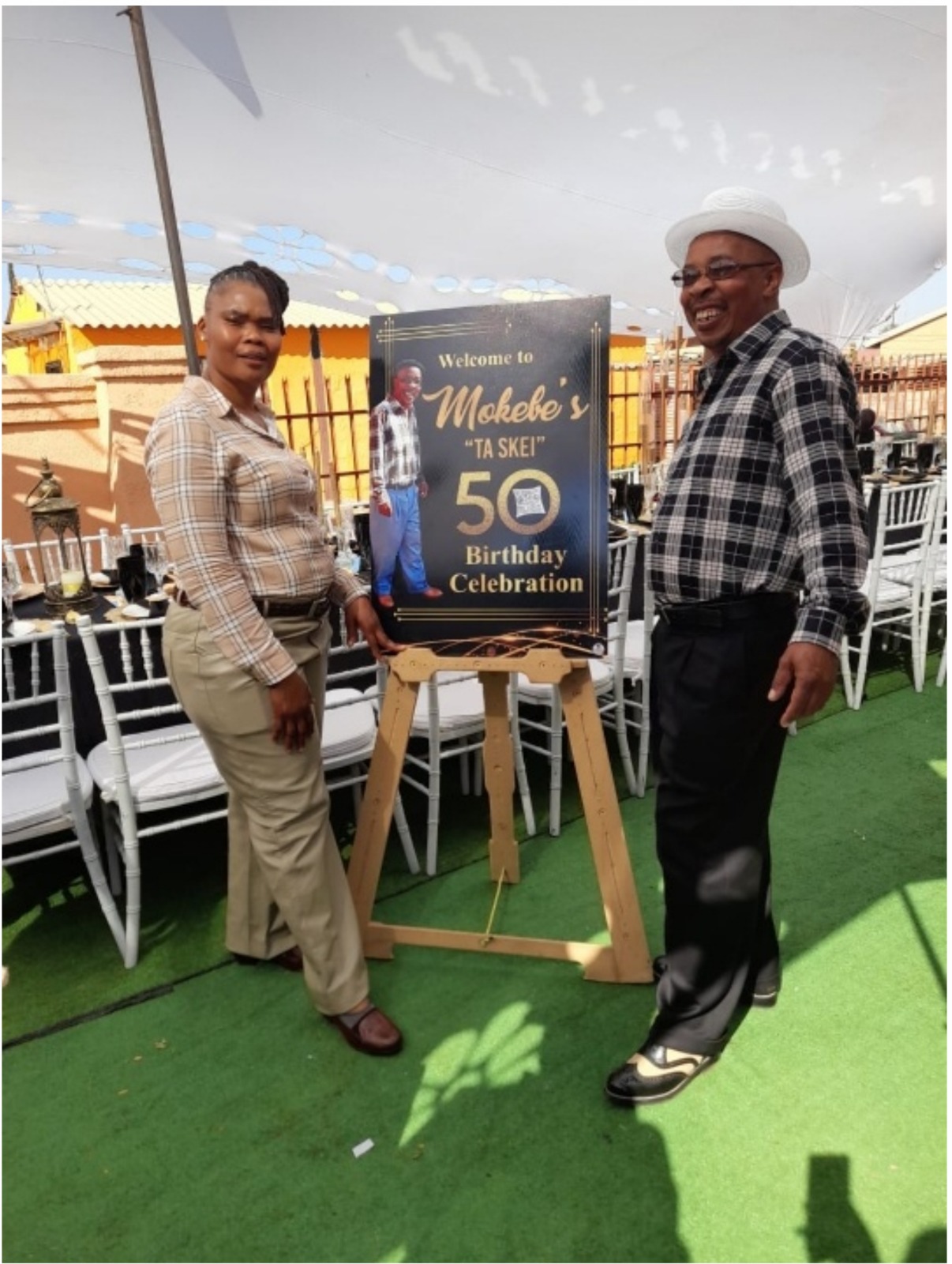 Custom printed 50th birthday welcome board on an easel