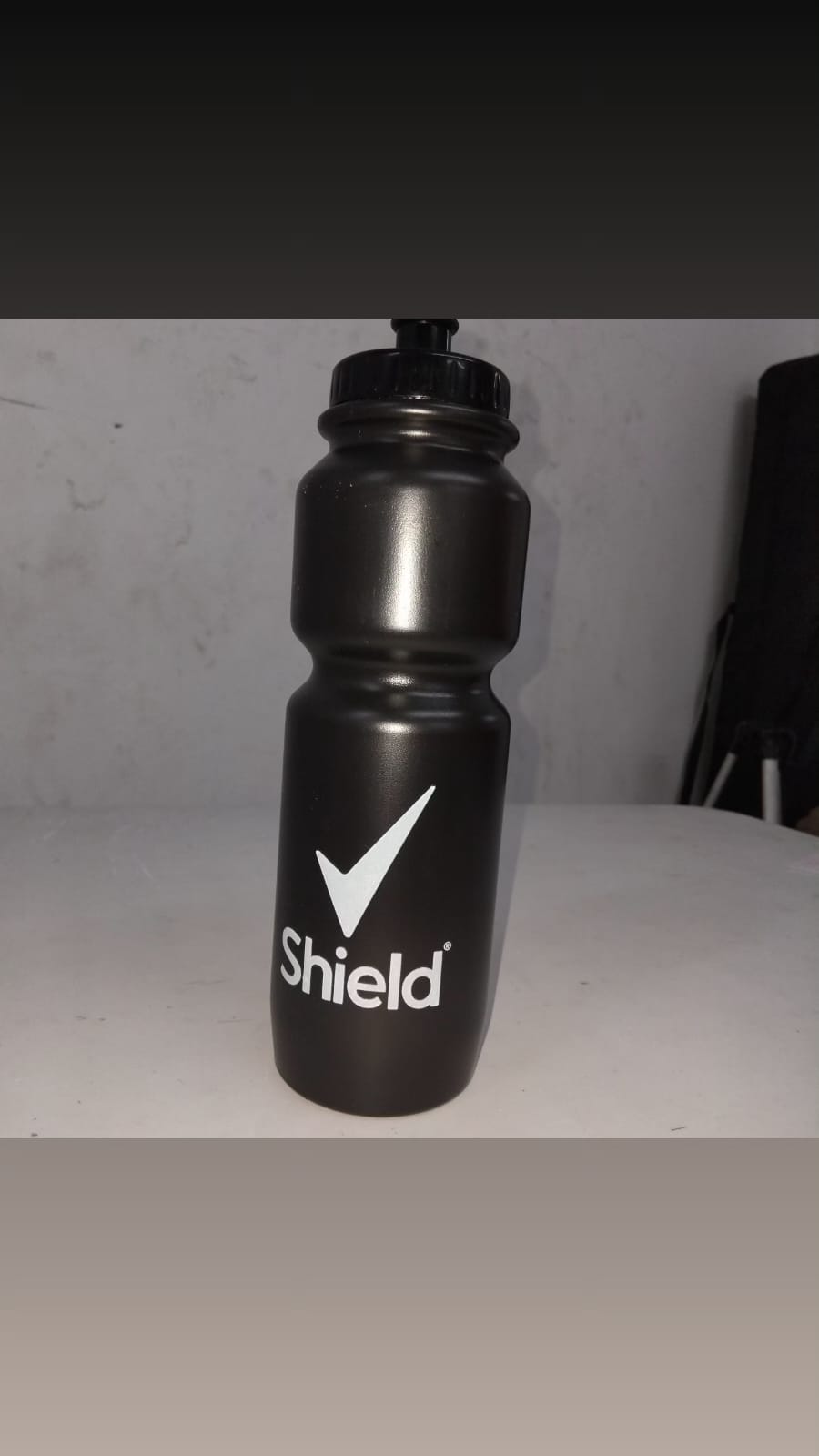 Shield branded black water bottle
